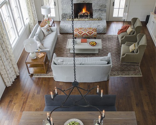 A living room with two couches and a fireplace.